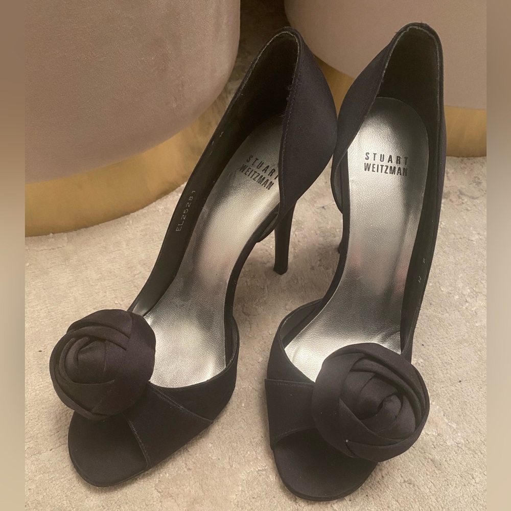 Stuart Weitzman satin pumps with a black rose
